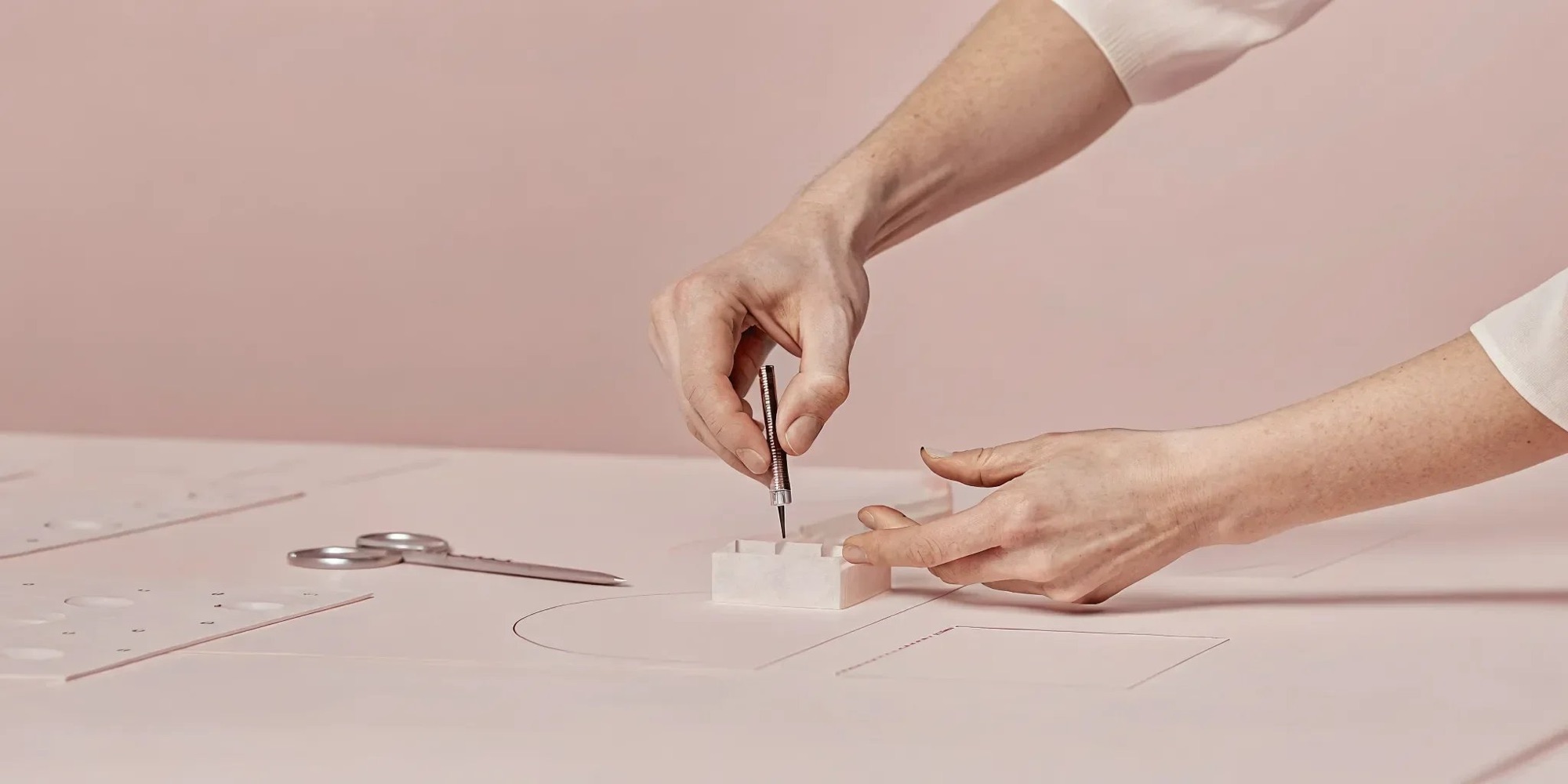 Designer and engineer reviewing a product prototype together at a workbench