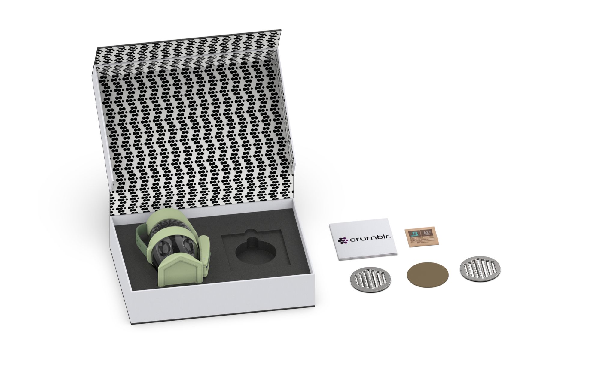 A white box containing virtual reality goggles with a green frame, two silver circular objects, a brown circular object, a small notebook with 'crumbl' logo, a small card showing 62%, and a white background.