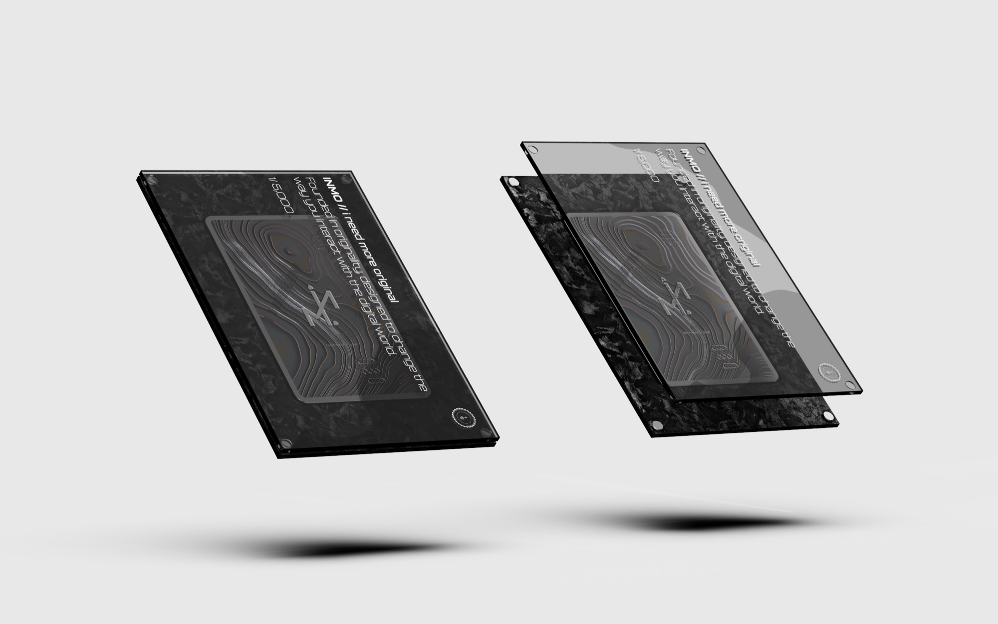 Two floating rectangular electronic chips with black marble textures, one in black and the other in transparent with a black marble background, each with printed text and a topographical design on the surface, casting shadows below.
